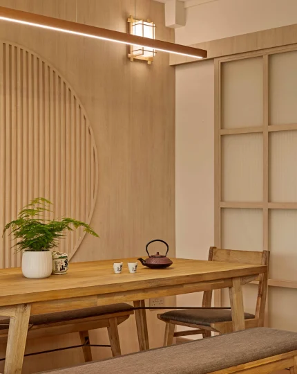 Dining corner with shoji-style doors and the circular slatted wall detail.